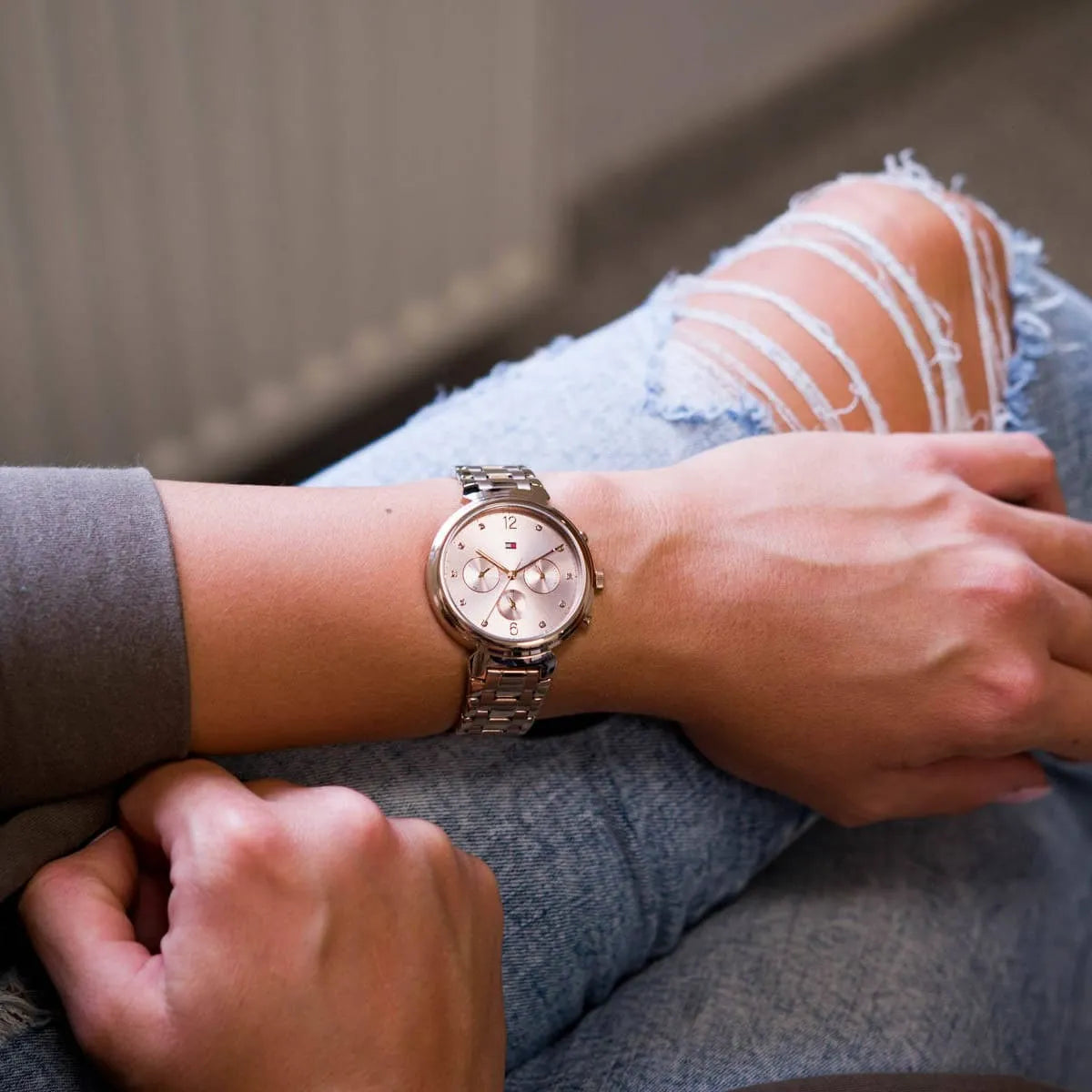 Tommy Hilfiger Ivy ladies watch worn on wrist with pink dial and rose gold strap