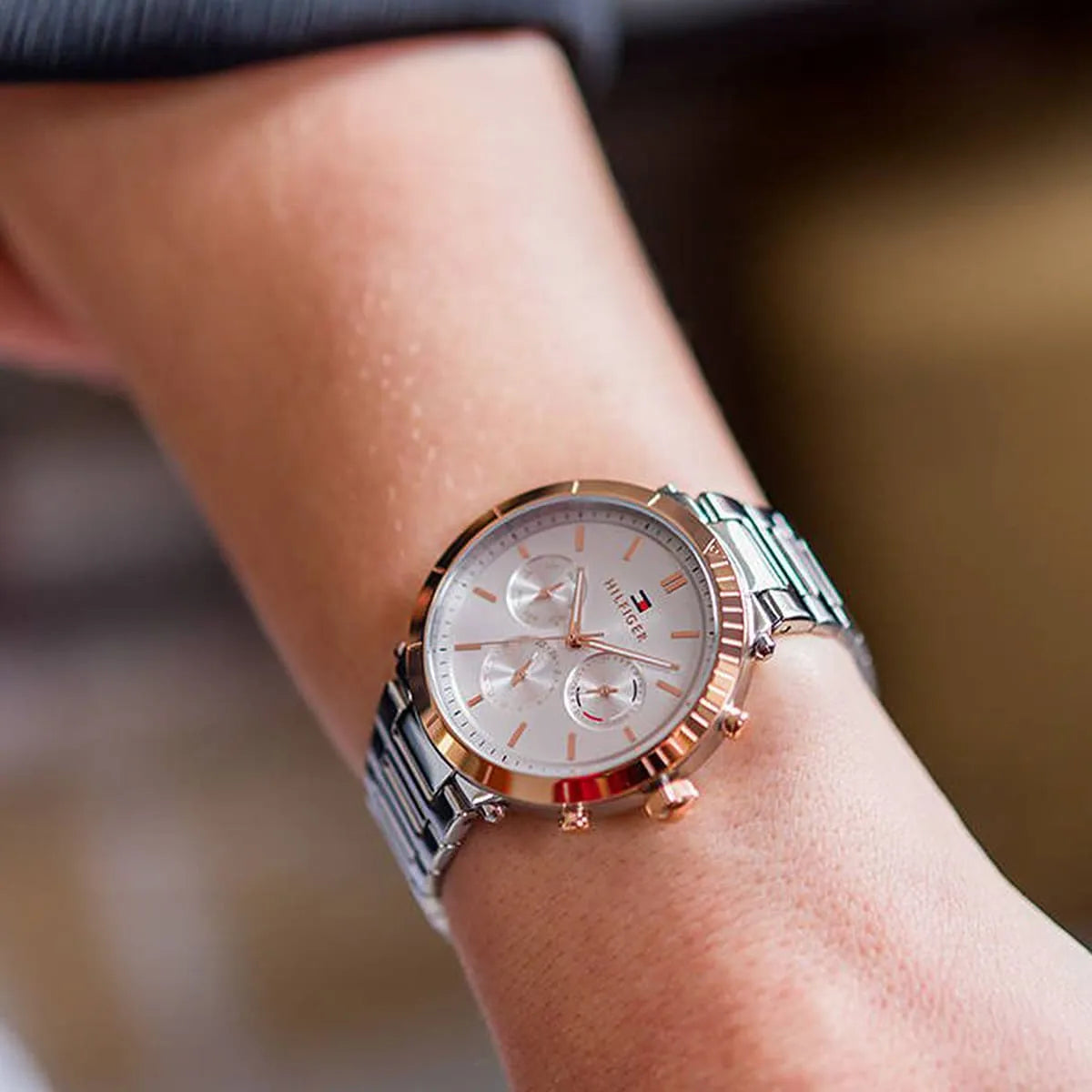 Tommy Hilfiger Emery watch on wrist showing silver dial and rose gold bezel