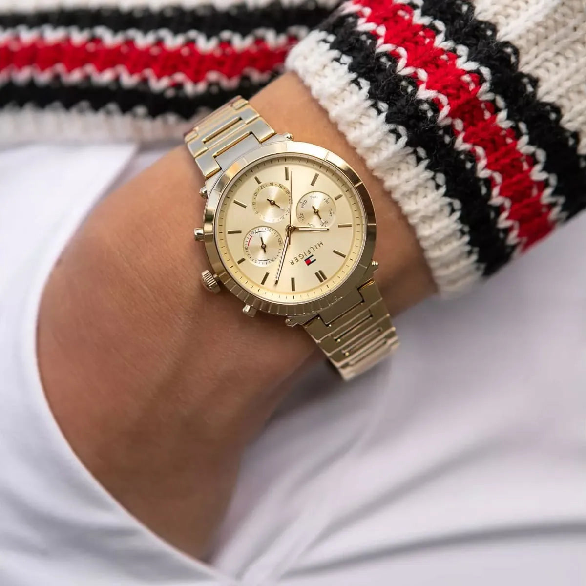 Tommy Hilfiger Emery gold chronograph watch on wrist with cream dial and metal bracelet