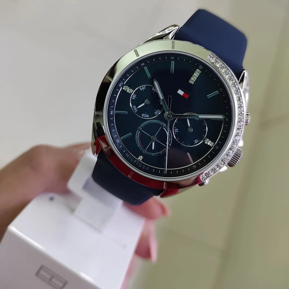 Tommy Hilfiger Kennedy women's watch on wrist showing navy dial and crystal bezel