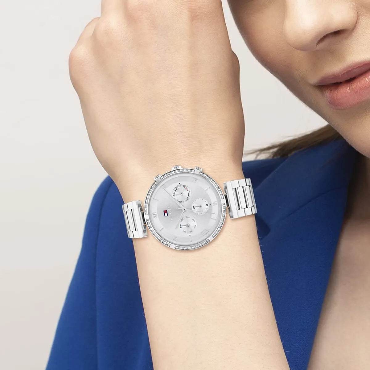 Tommy Hilfiger Luna silver watch worn on wrist with crystal bezel and metal strap