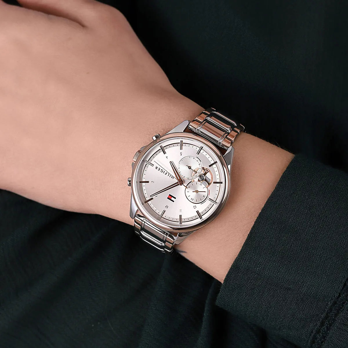 Tommy Hilfiger Quinn watch on wrist showing rose gold and steel two-tone design
