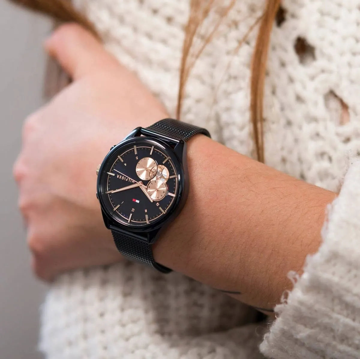Tommy Hilfiger women's watch on wrist showing blue dial and chronograph subdials