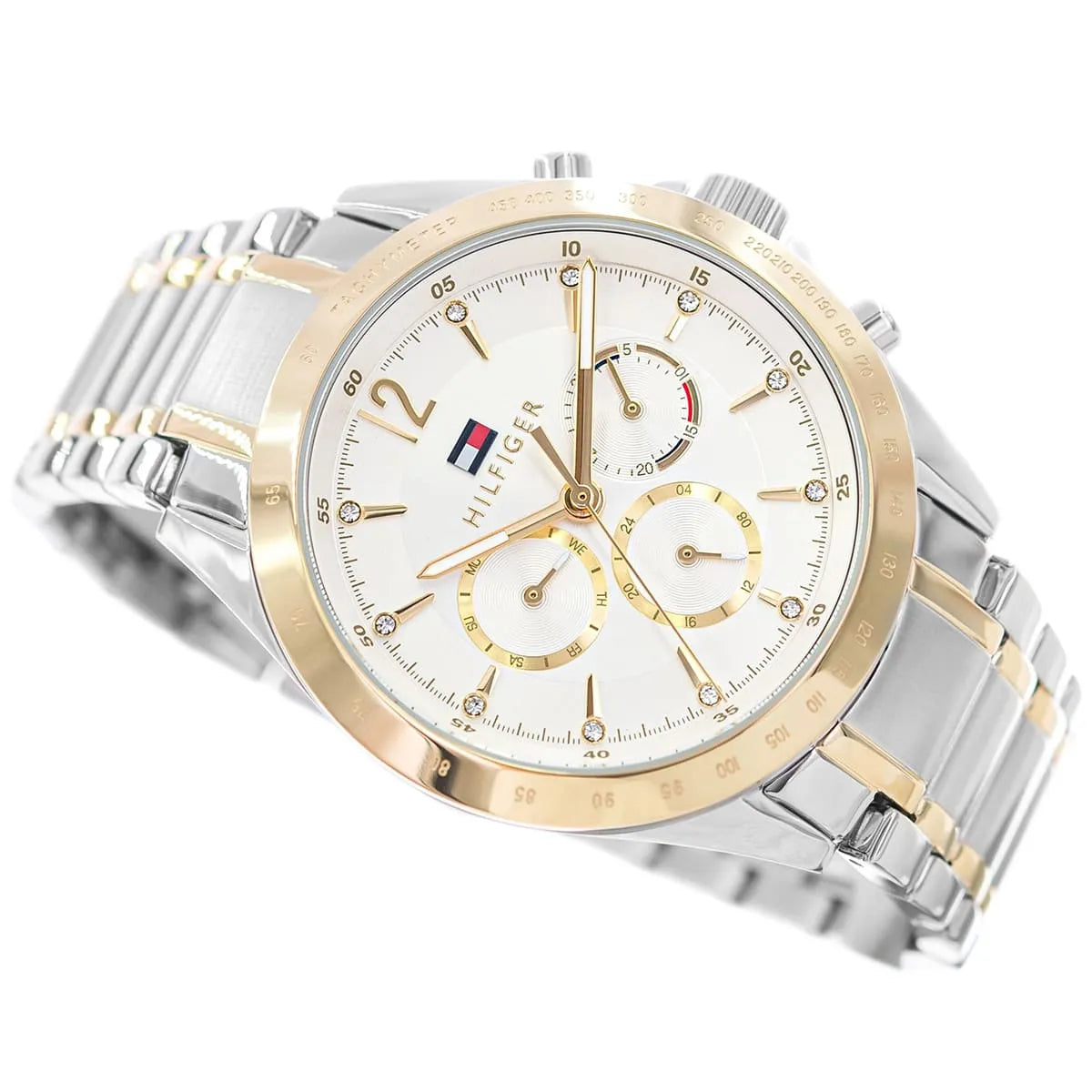 Close-up of white dial with gold accents, chronograph subdials and hour markers