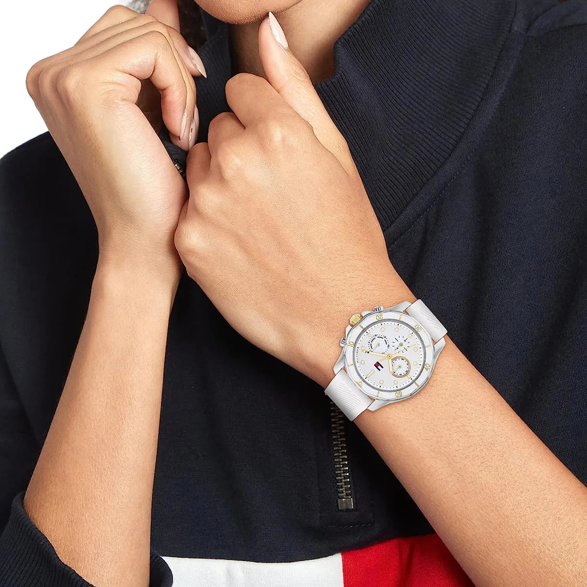 Tommy Hilfiger Libby watch on wrist showing chronograph watch face with white strap and gold accents