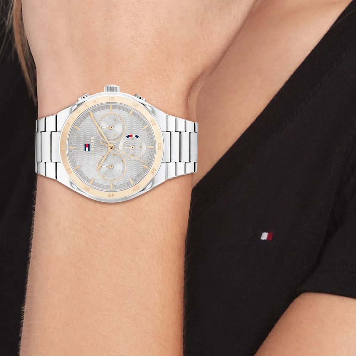 Tommy Hilfiger women's watch on wrist displaying gray dial with rose gold bezel and chronograph detail