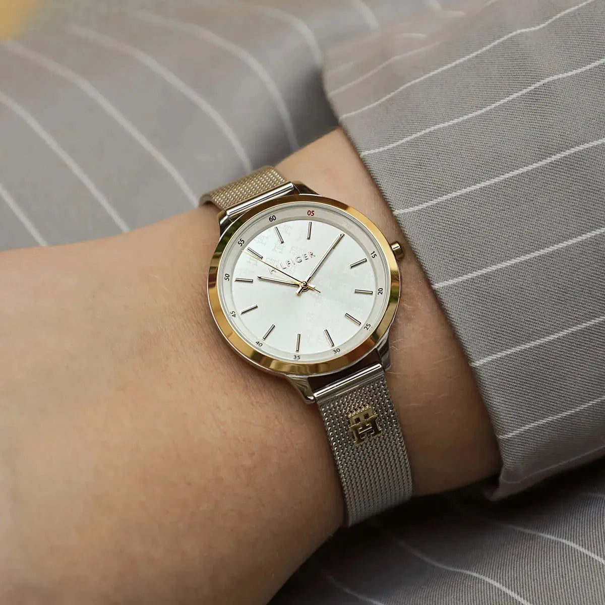 Tommy Hilfiger Iris women's watch on wrist with silver mesh band