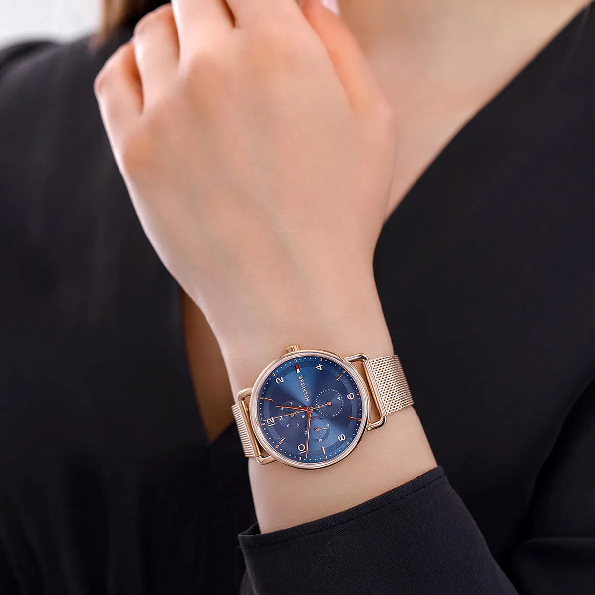 Tommy Hilfiger LILY blue dial watch worn on wrist with rose gold mesh strap