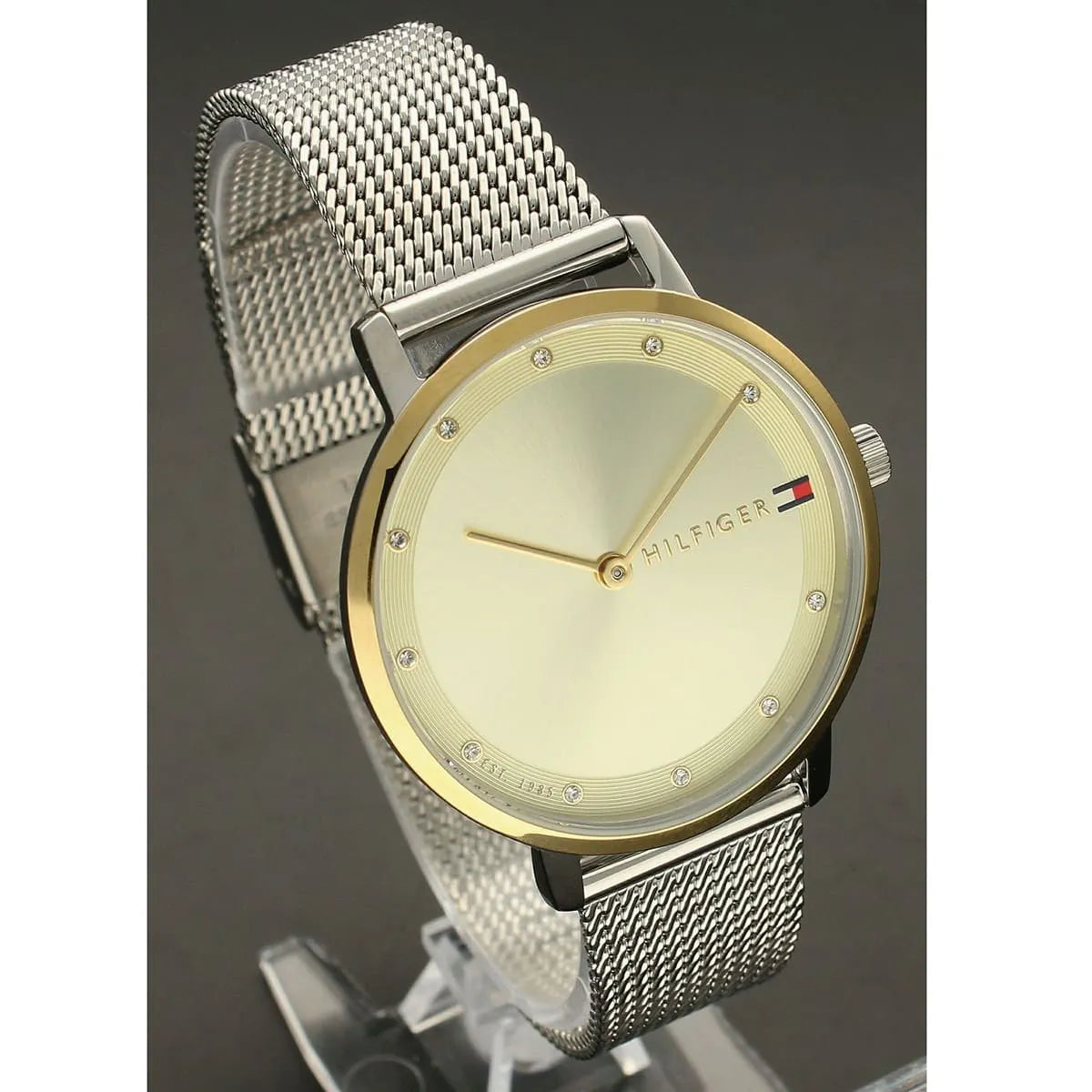 Champagne dial detail of Tommy Hilfiger watch with applied indices and three-hand movement