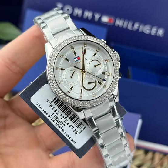 Tommy Hilfiger 1782677 men's chronograph watch worn on wrist, displayed with retail tag