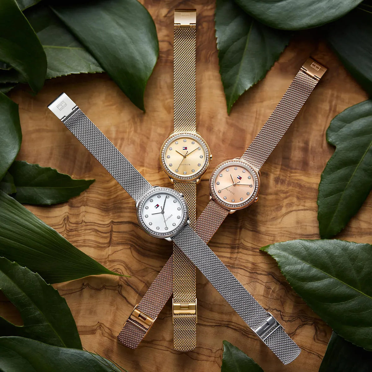 Multiple Tommy Hilfiger women's watches in silver and rose gold displayed together