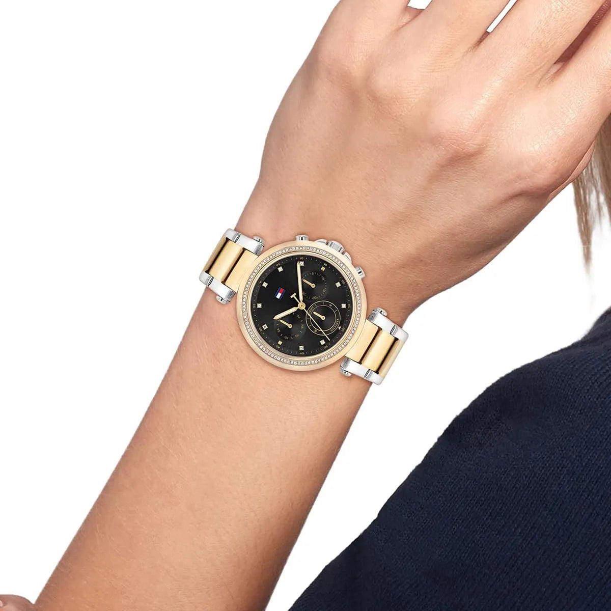 Tommy Hilfiger Emily chronograph watch worn on wrist showing black dial with gold hands