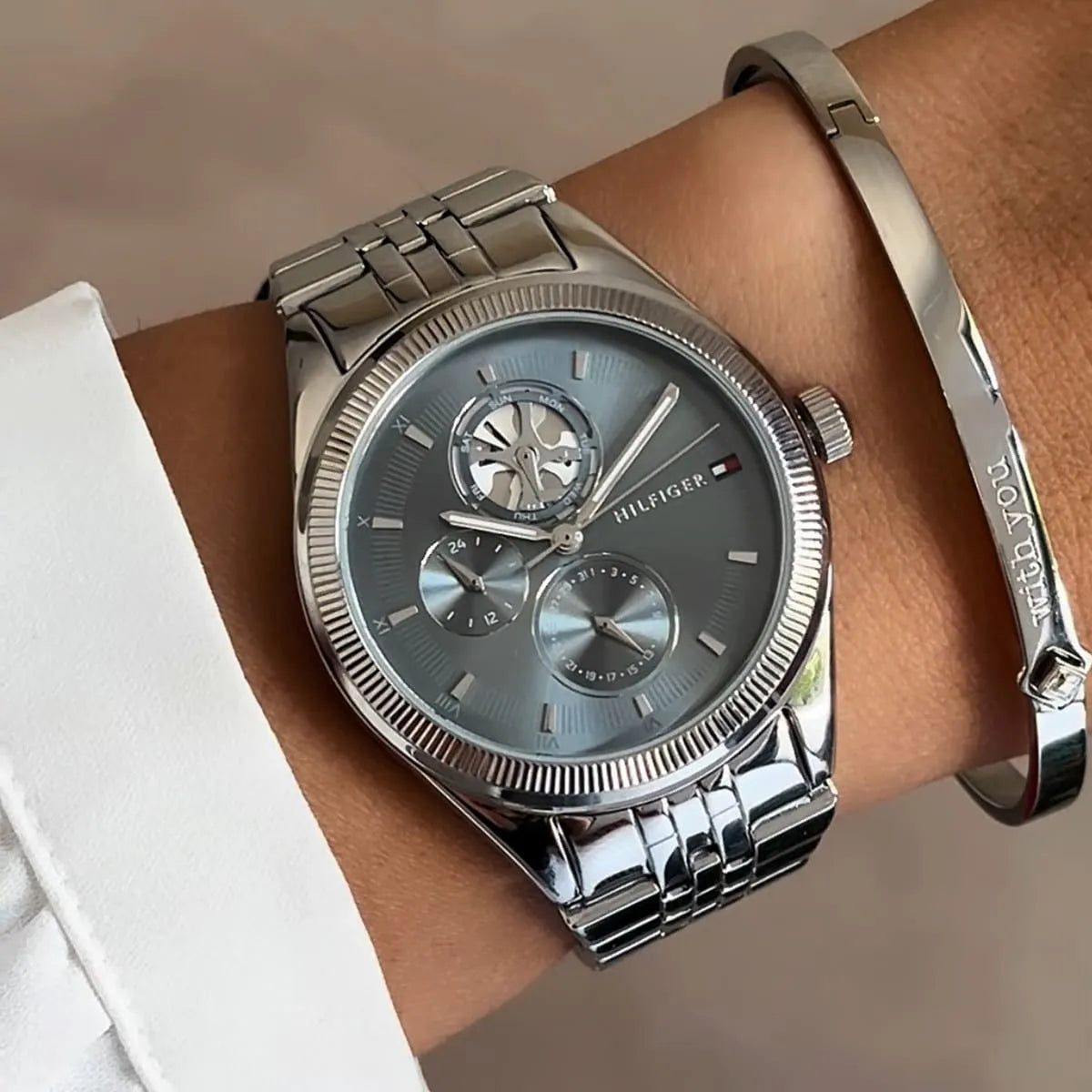 Tommy Hilfiger Monica women's watch worn on wrist with silver stainless steel bracelet