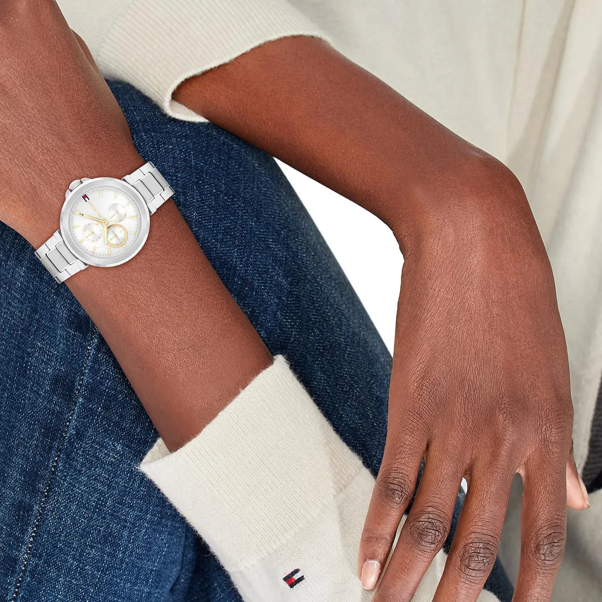 Tommy Hilfiger Lori silver watch worn on wrist with gold-tone chronograph subdials