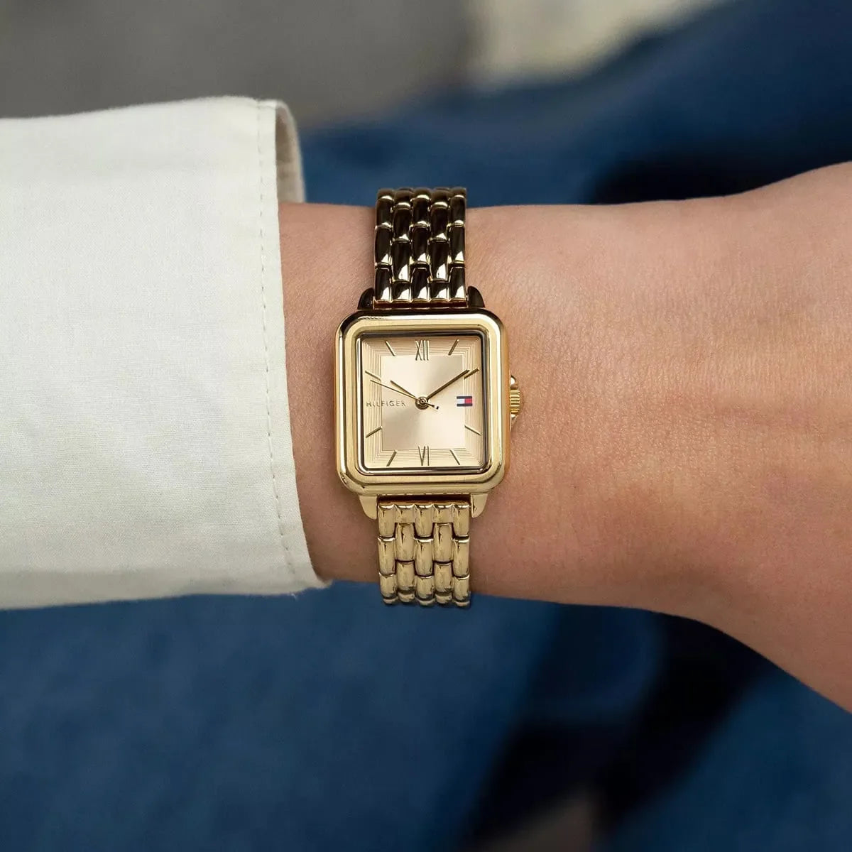 Tommy Hilfiger Mia gold watch worn on wrist showing square face and bracelet fit