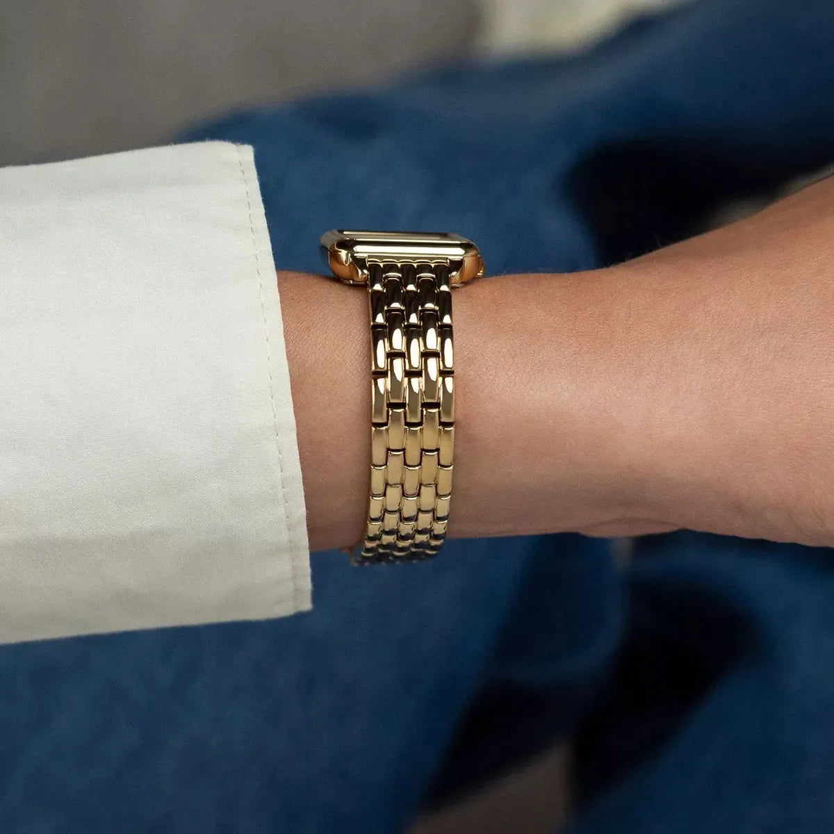 Side view of Tommy Hilfiger Mia watch on wrist showing gold bracelet strap detail