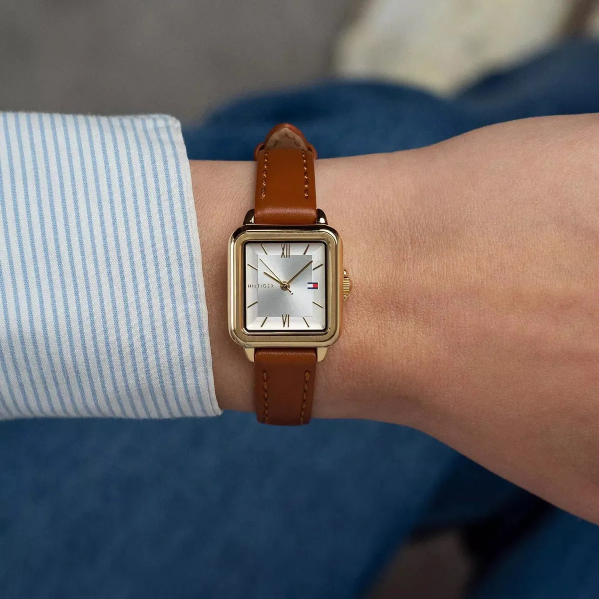 Tommy Hilfiger Mia gold-plated watch on wrist with brown leather strap