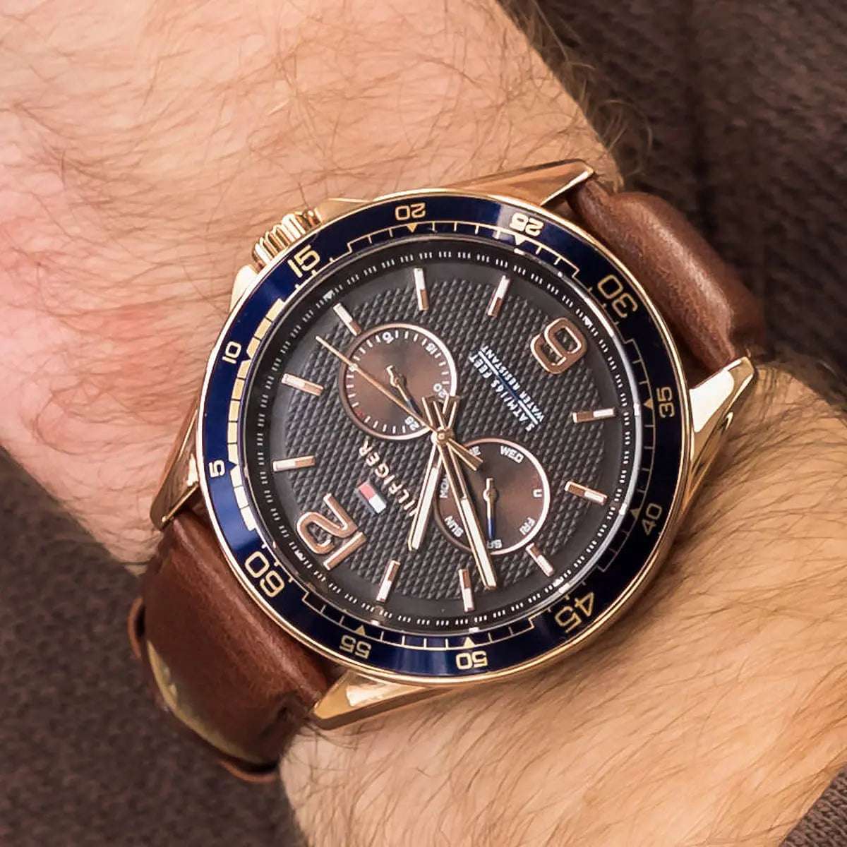 Tommy Hilfiger 1791367 watch worn on wrist showing black dial and chronograph function
