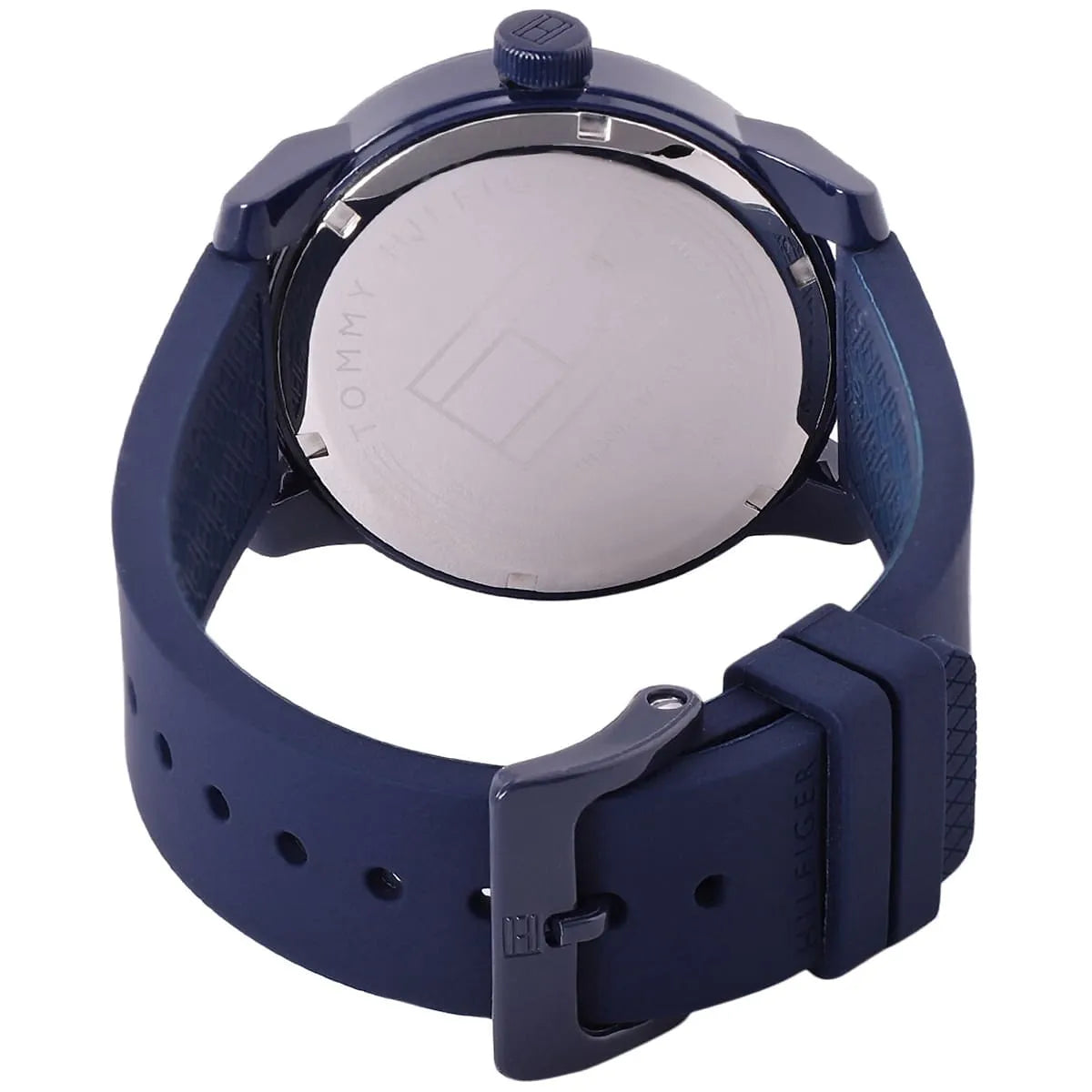 Back view of Tommy Hilfiger watch showing case back and rubber strap adjustment holes
