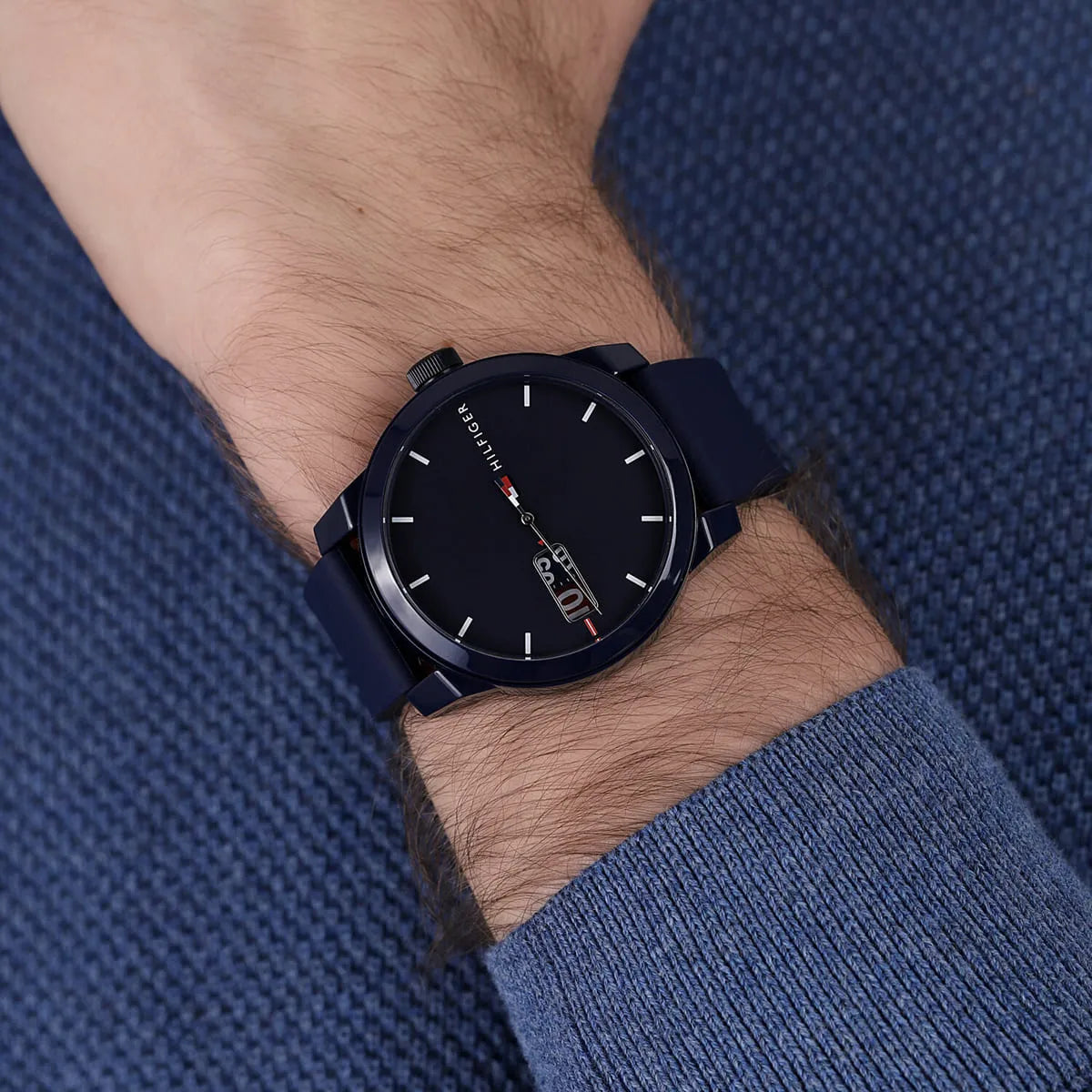 Tommy Hilfiger watch worn on wrist showing navy blue dial and rubber strap fit