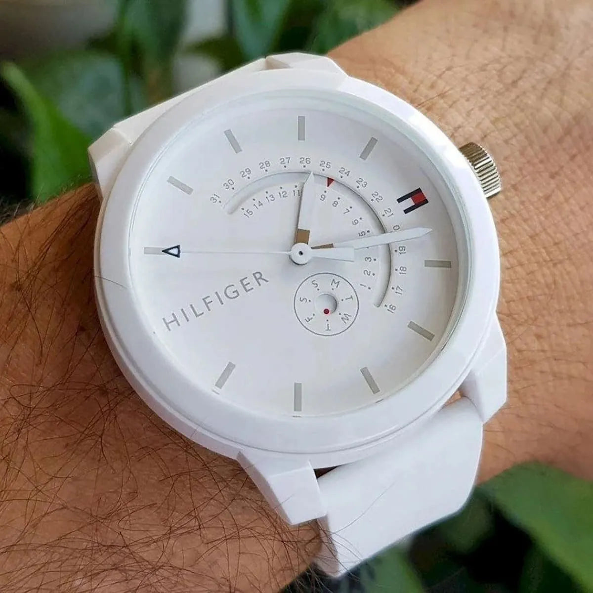 Tommy Hilfiger Denim white watch on wrist with white silicone band and analog dial