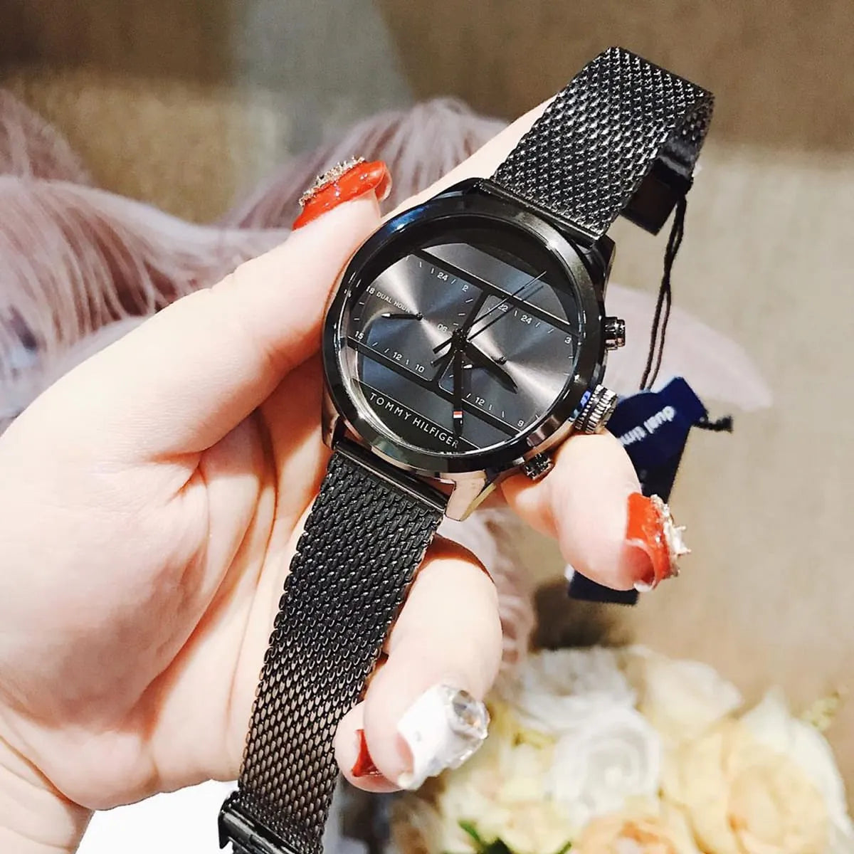 Tommy Hilfiger 1791597 chronograph watch worn on wrist with mesh band and box