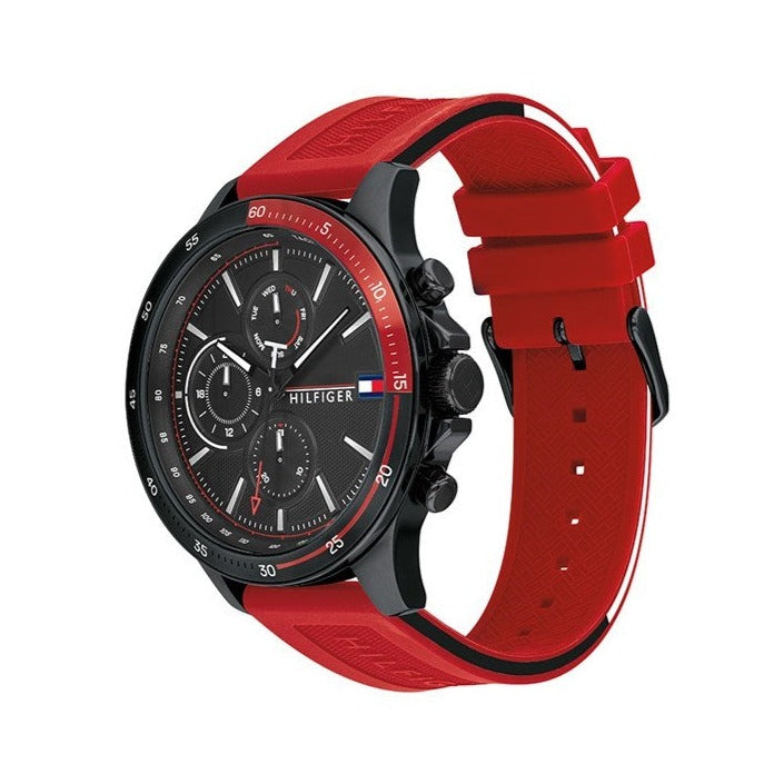Side angle view of Tommy Hilfiger watch showing red rubber strap and black case