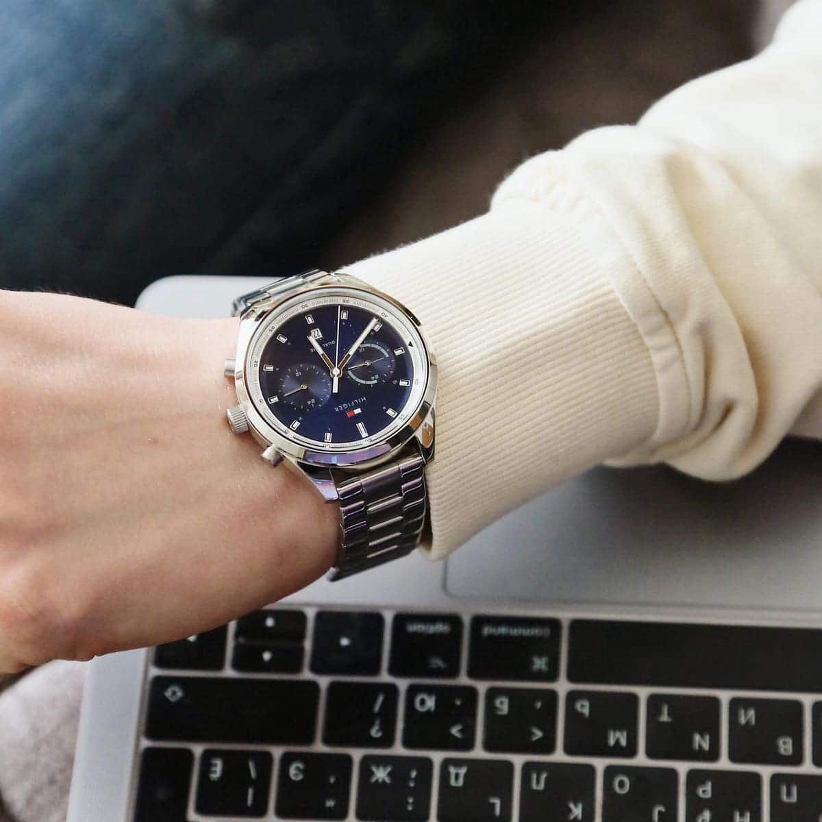Tommy Hilfiger Bennett watch on wrist showing blue dial with chronograph subdials and stainless steel bracelet