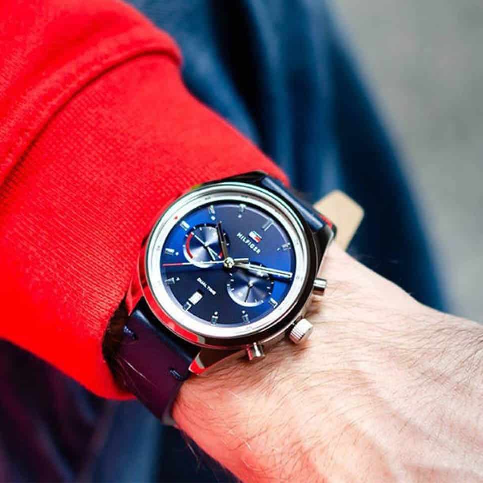 Tommy Hilfiger Bennett watch worn on wrist with blue dial and red chronograph hands visible