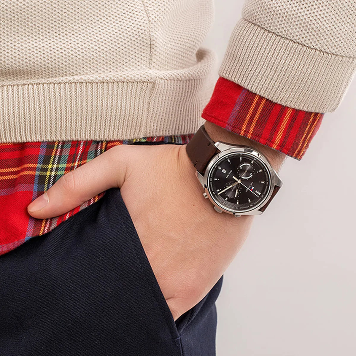 Tommy Hilfiger Bennett chronograph watch on wrist with red plaid sleeve detail