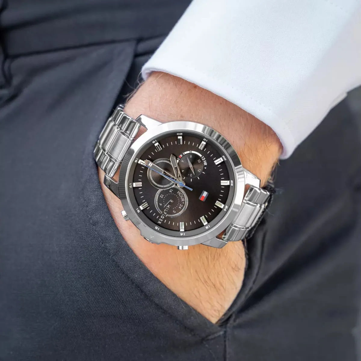 Tommy Hilfiger Jameson chronograph watch worn on wrist with white shirt and navy blazer