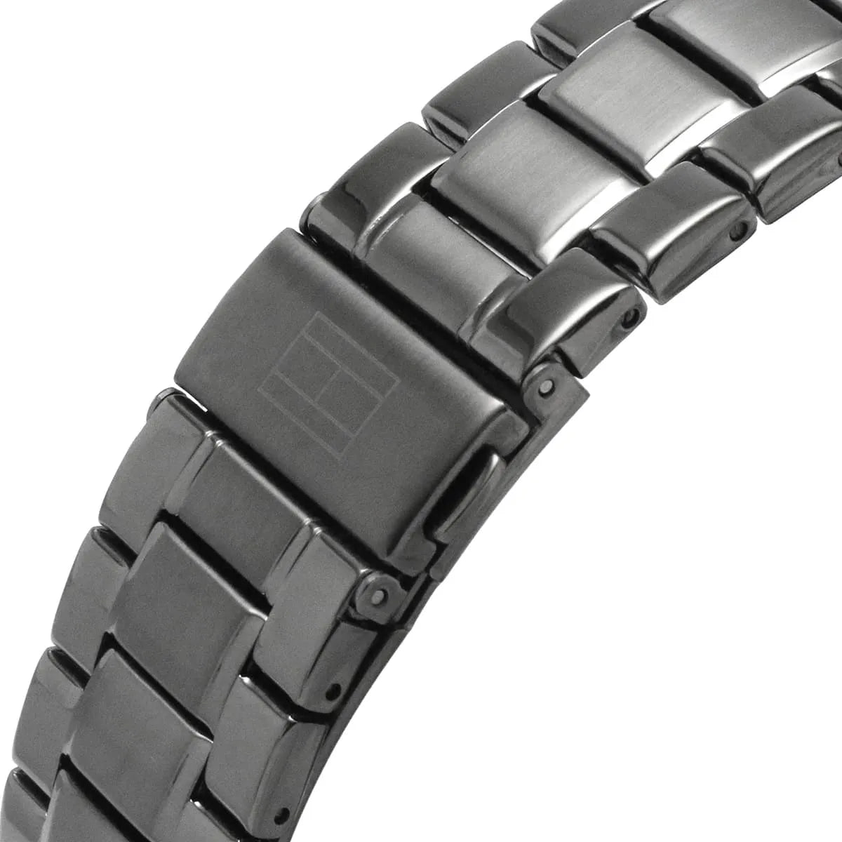 Close-up of gray stainless steel three-link bracelet with brushed and polished finish