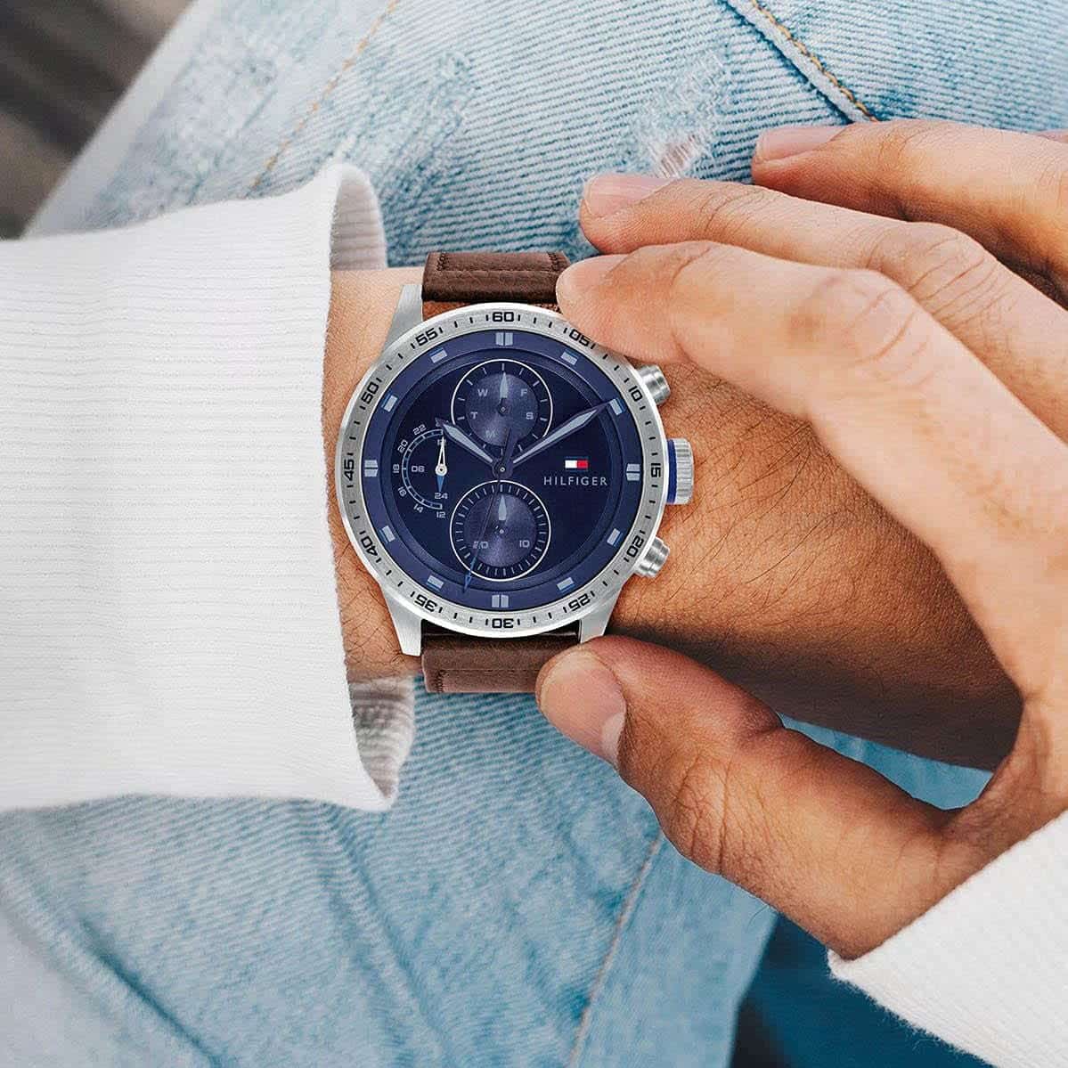 Tommy Hilfiger chronograph watch on wrist with blue dial and dual subdials
