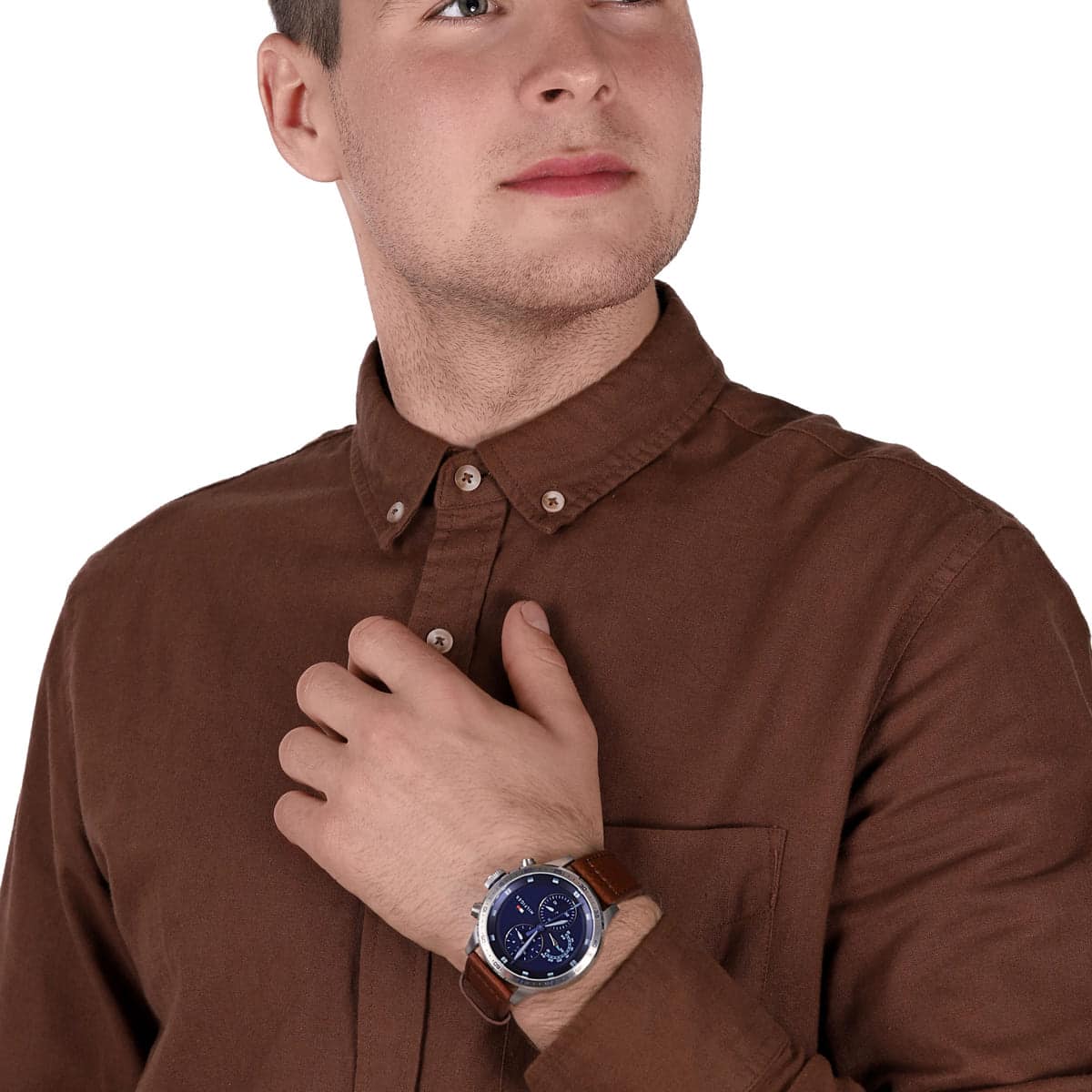 Tommy Hilfiger chronograph watch on wrist as worn on brown button-up shirt