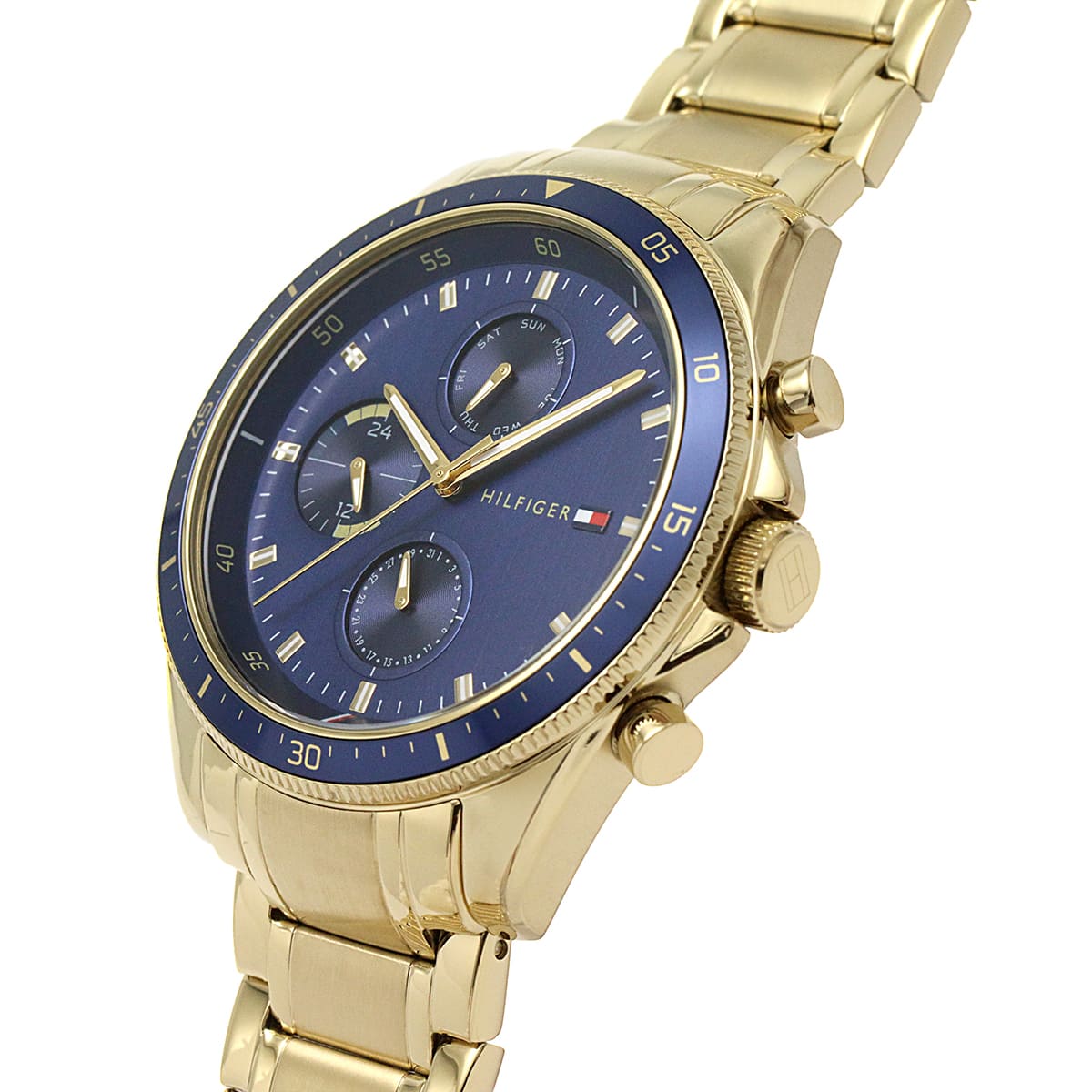 Tommy Hilfiger chronograph watch side angle showing navy blue dial and gold-tone case