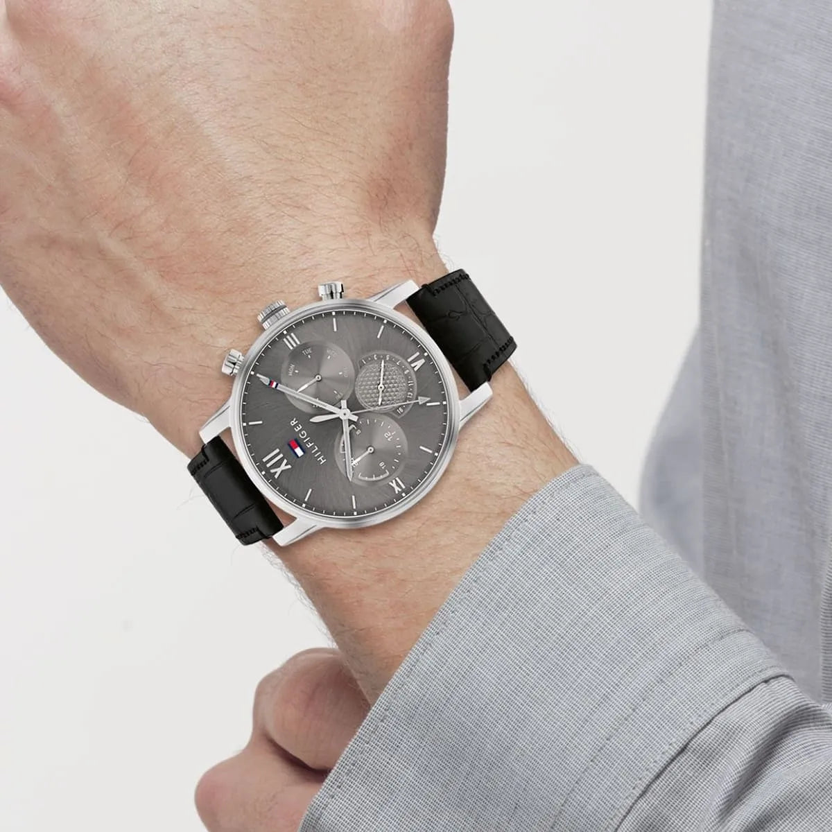 Tommy Hilfiger 1791883 chronograph watch worn on wrist with black leather strap