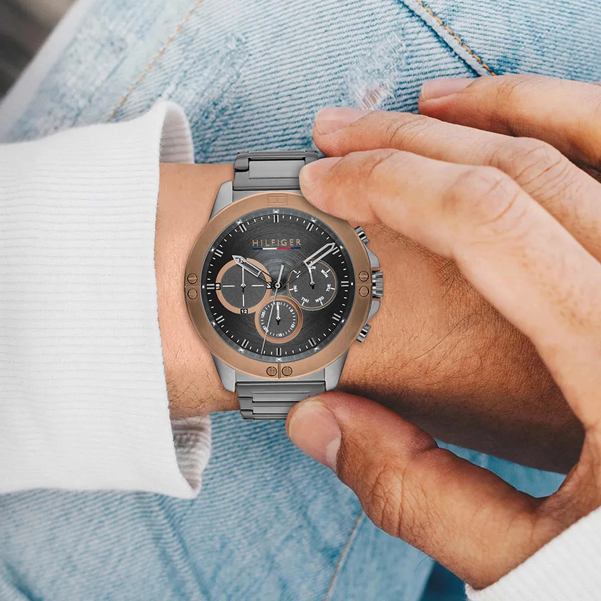 Tommy Hilfiger 1791892 watch on wrist styled with blue denim shirt