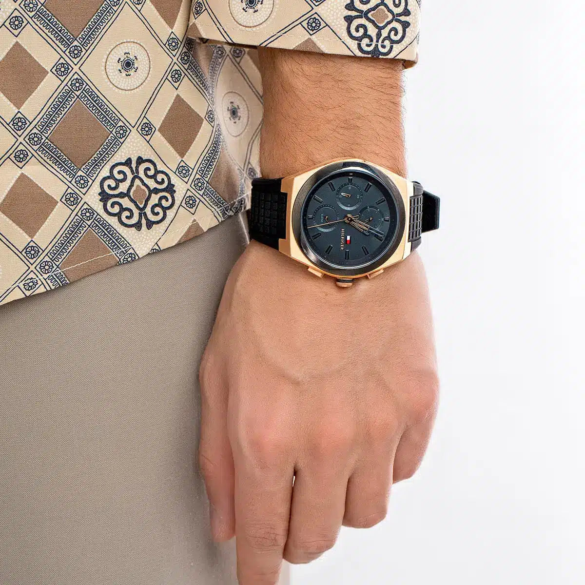 Tommy Hilfiger Connor chronograph watch worn on wrist with rose gold and black case