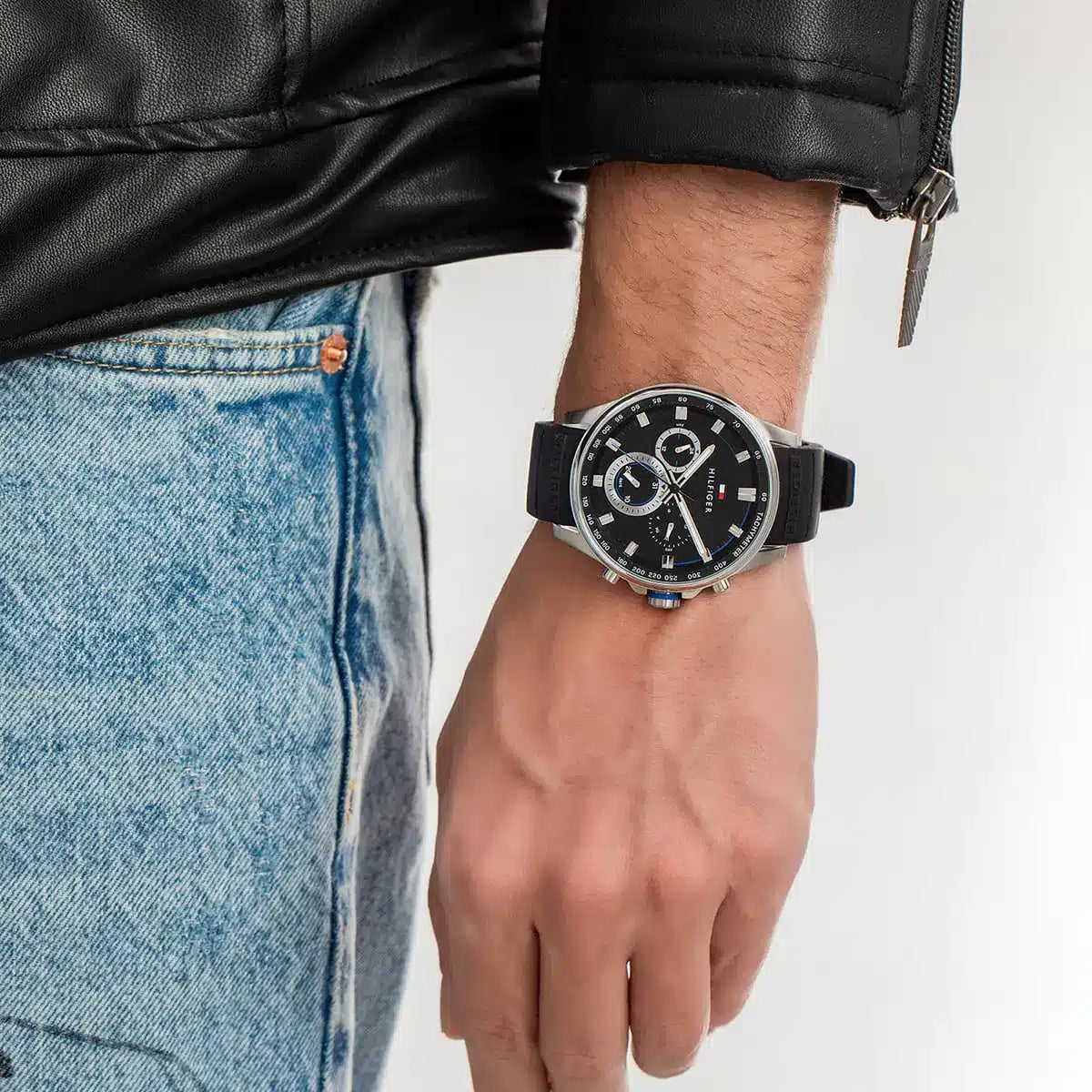 Tommy Hilfiger Max watch with black dial worn on wrist with casual attire
