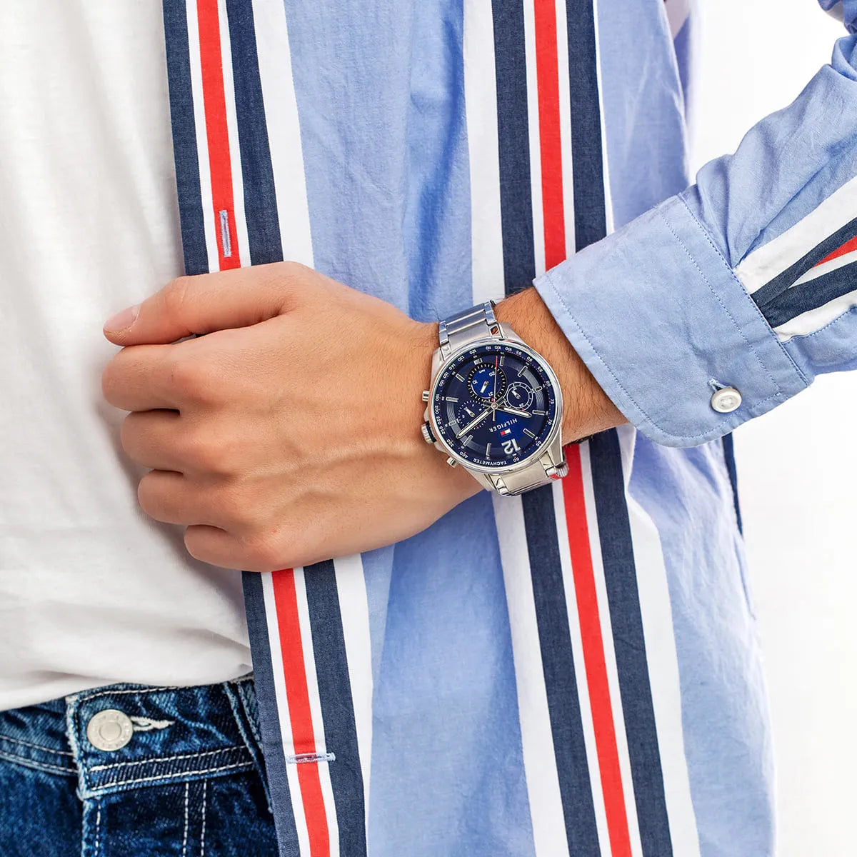 Tommy Hilfiger Max watch worn on wrist with striped shirt styling