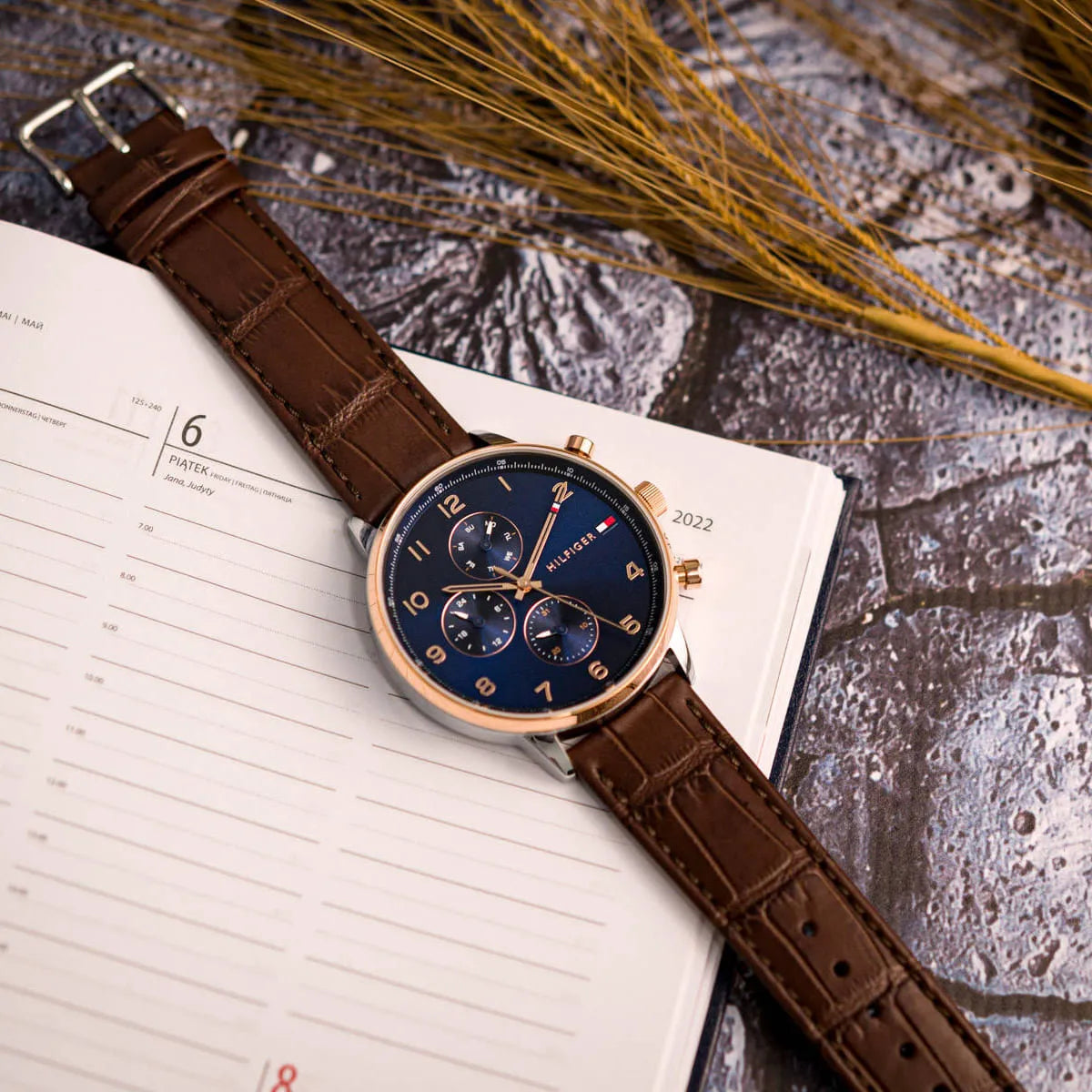 Tommy Hilfiger Leonard chronograph with blue dial, three subdials, and brown leather strap
