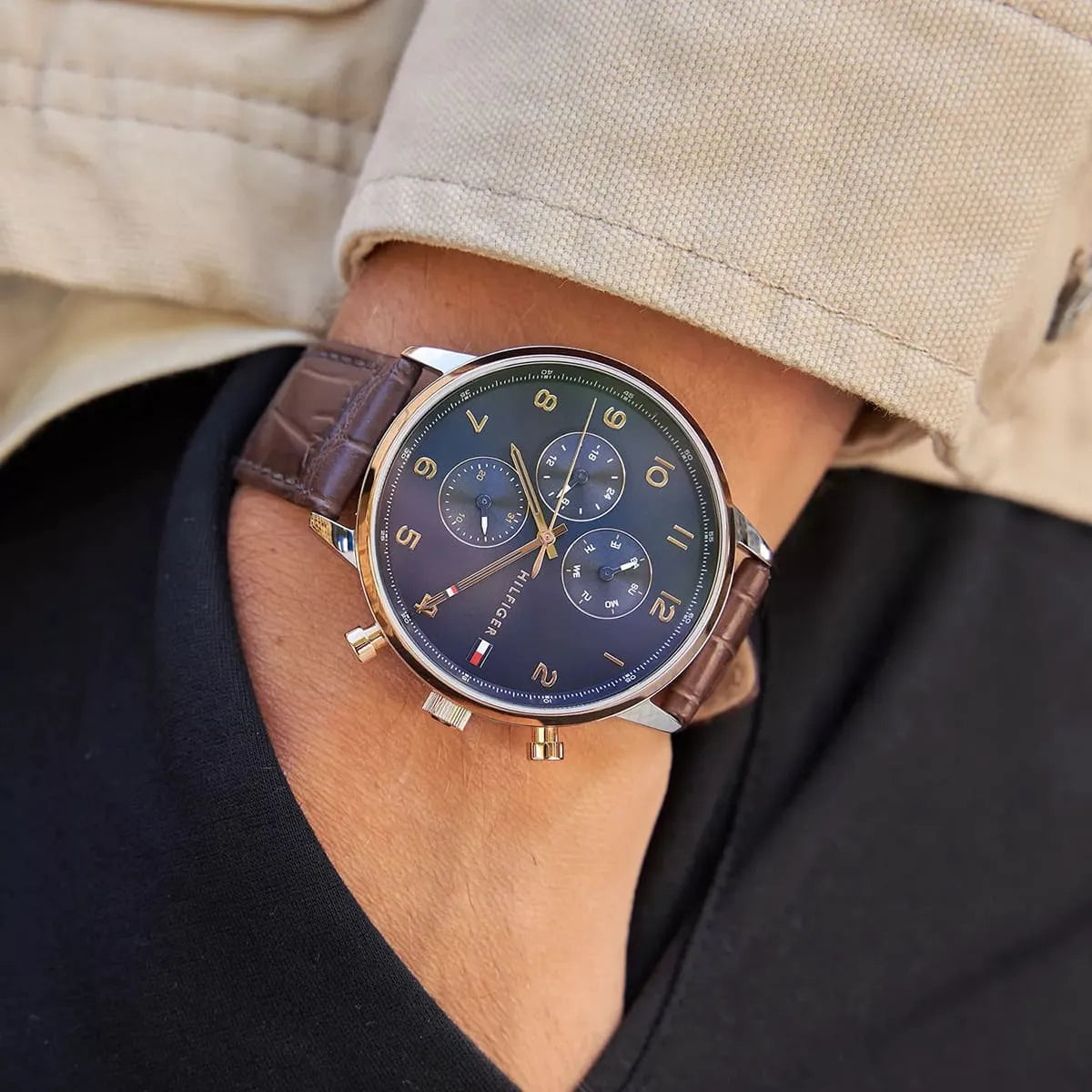 Tommy Hilfiger Leonard chronograph watch worn on wrist with striped shirt
