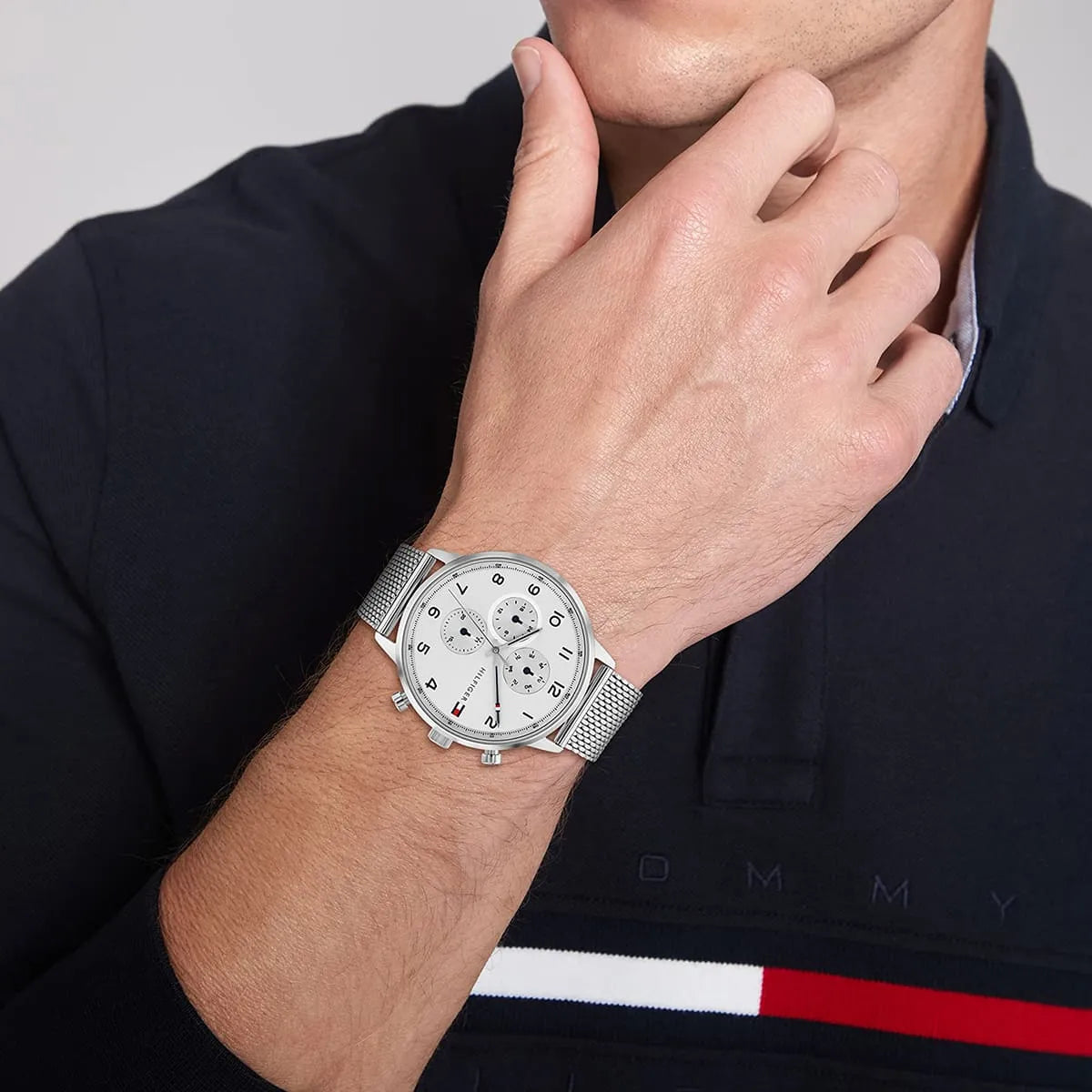 Tommy Hilfiger Leonard men's watch on wrist showing white dial and chronograph subdials