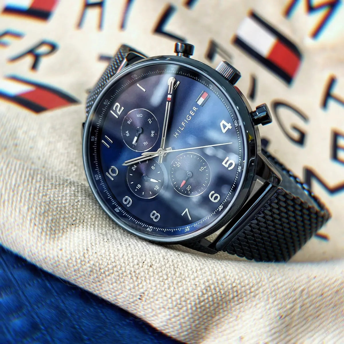 Tommy Hilfiger Leonard chronograph watch on textile background with brand details