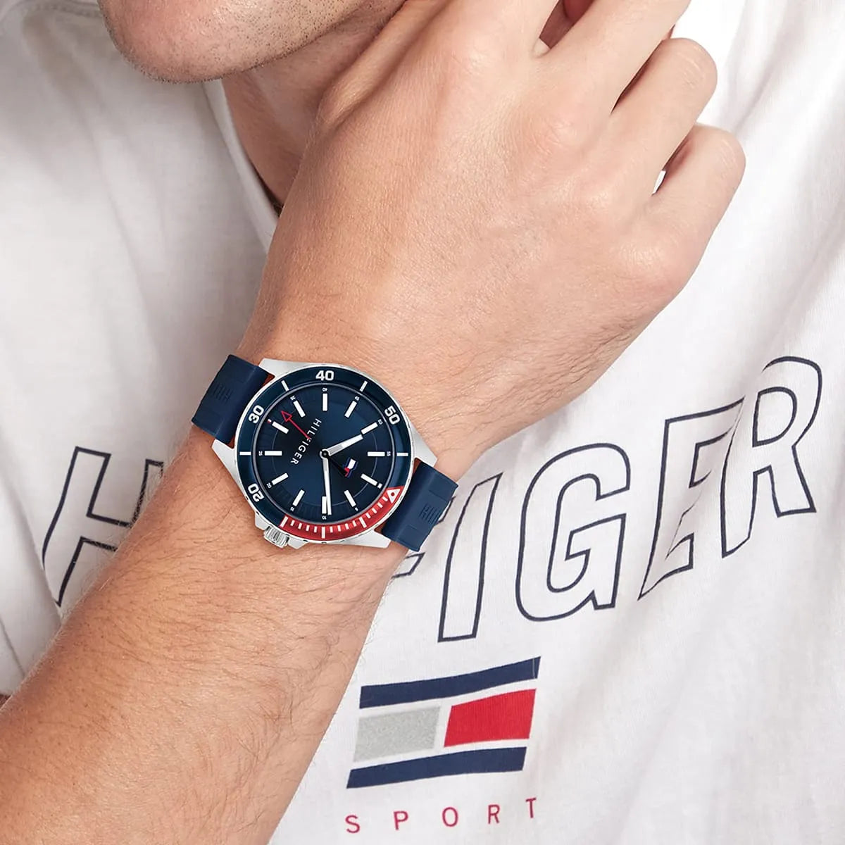 Tommy Hilfiger Logan watch worn on wrist with Tommy Sport branded clothing