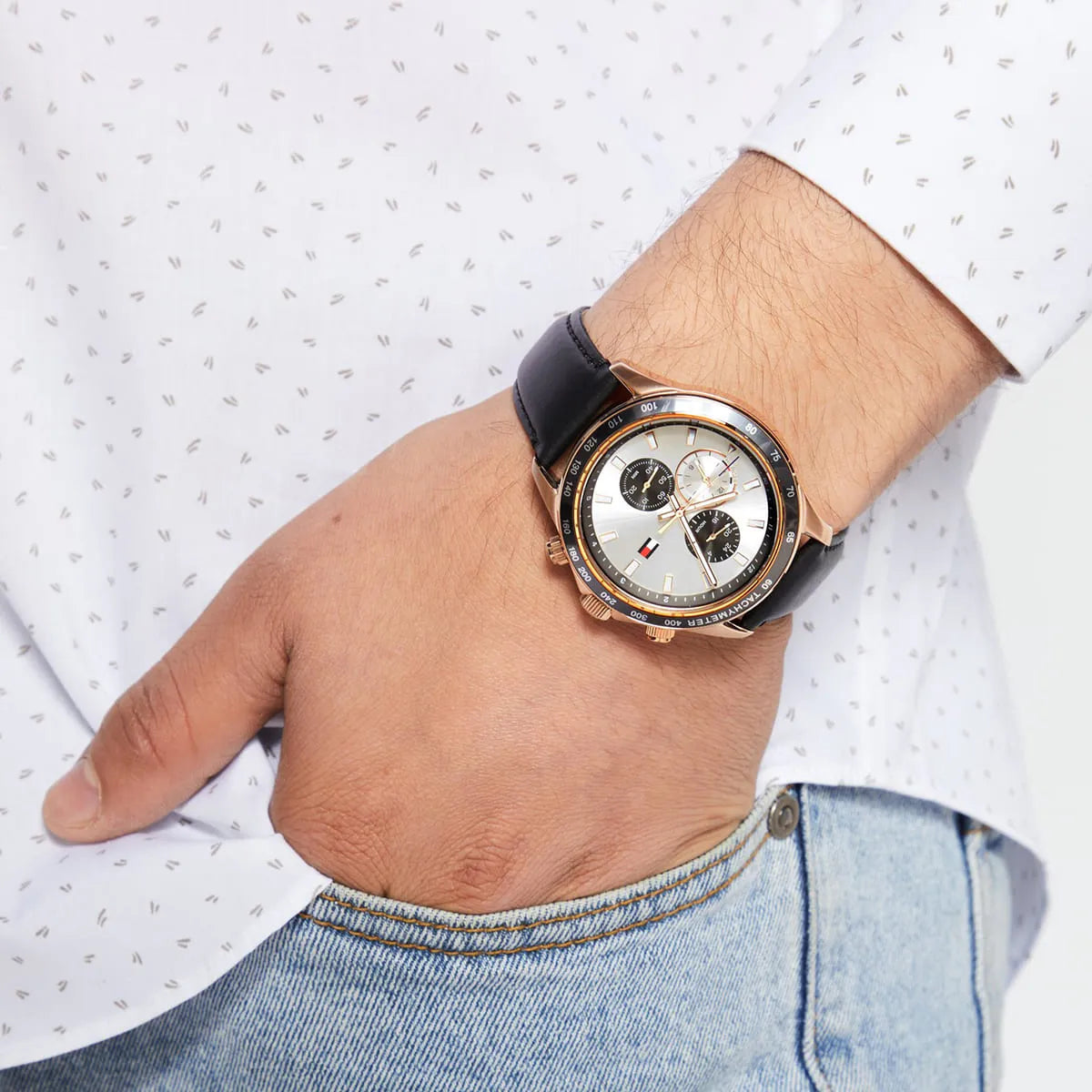 Tommy Hilfiger chronograph watch worn on wrist with white shirt sleeve