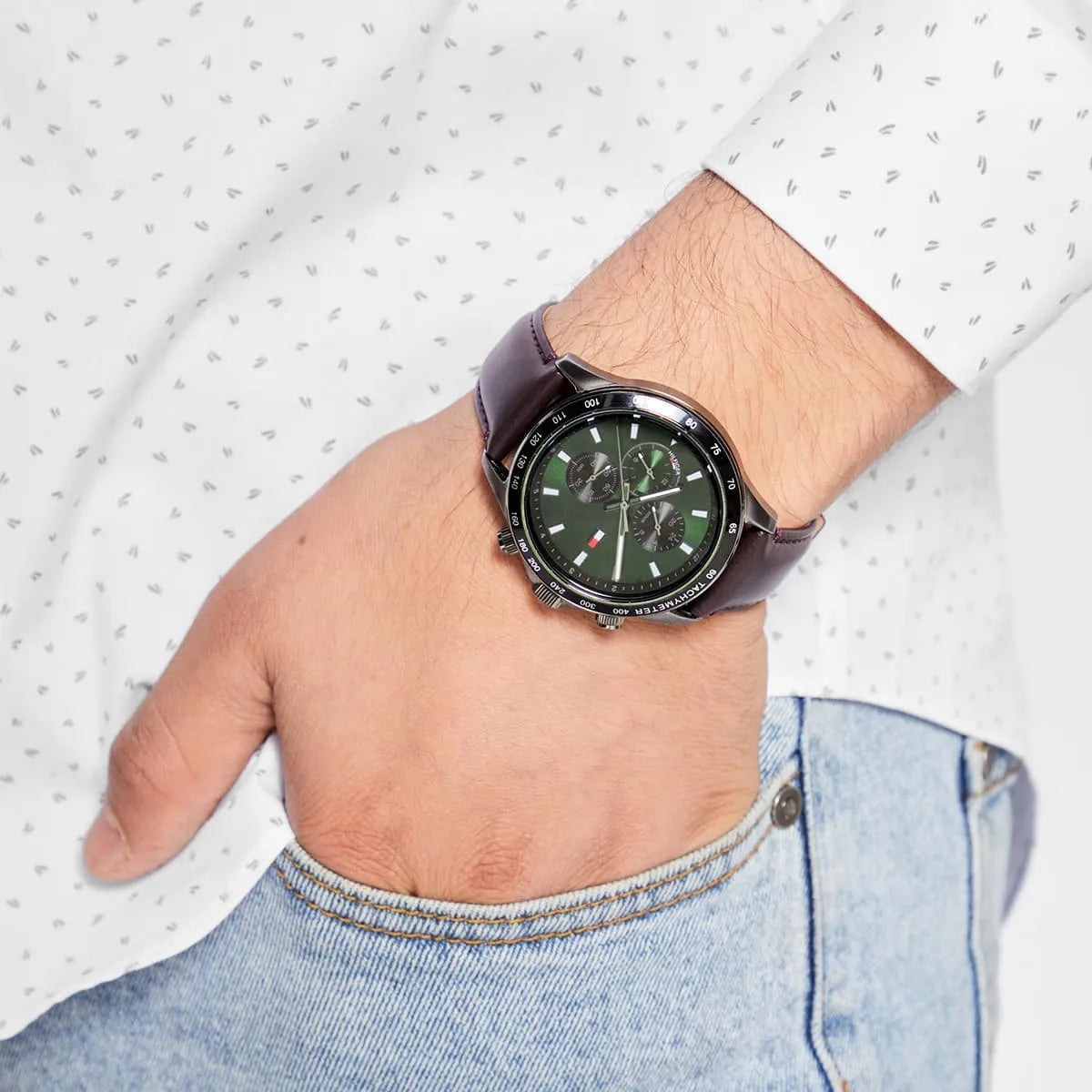 Tommy Hilfiger Miles watch on wrist with green dial and brown leather strap