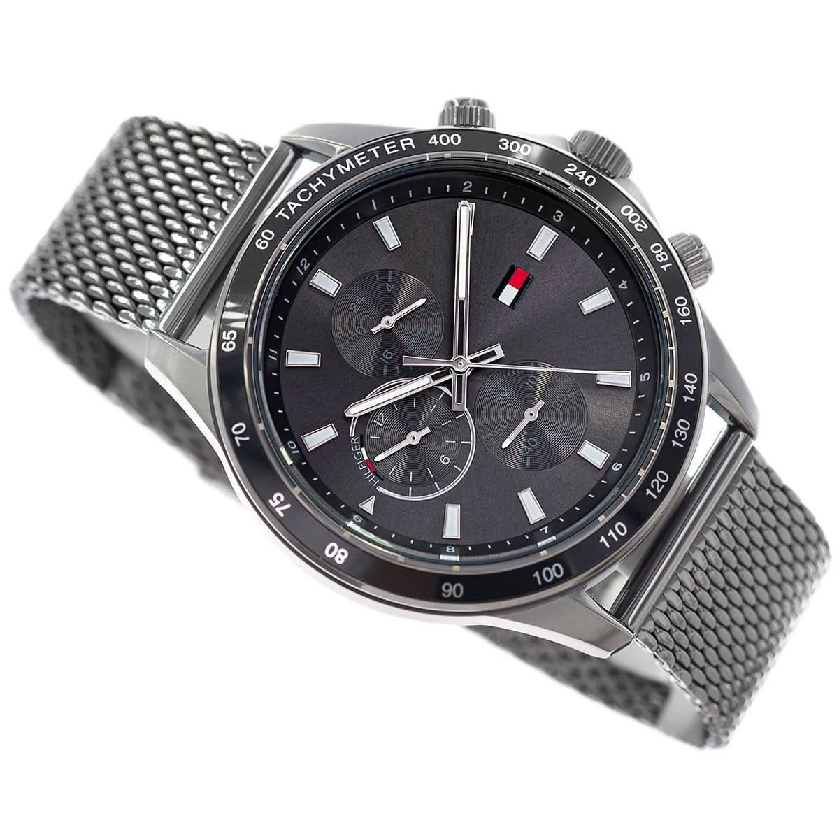 Tommy Hilfiger Miles chronograph watch worn on wrist with steel mesh band