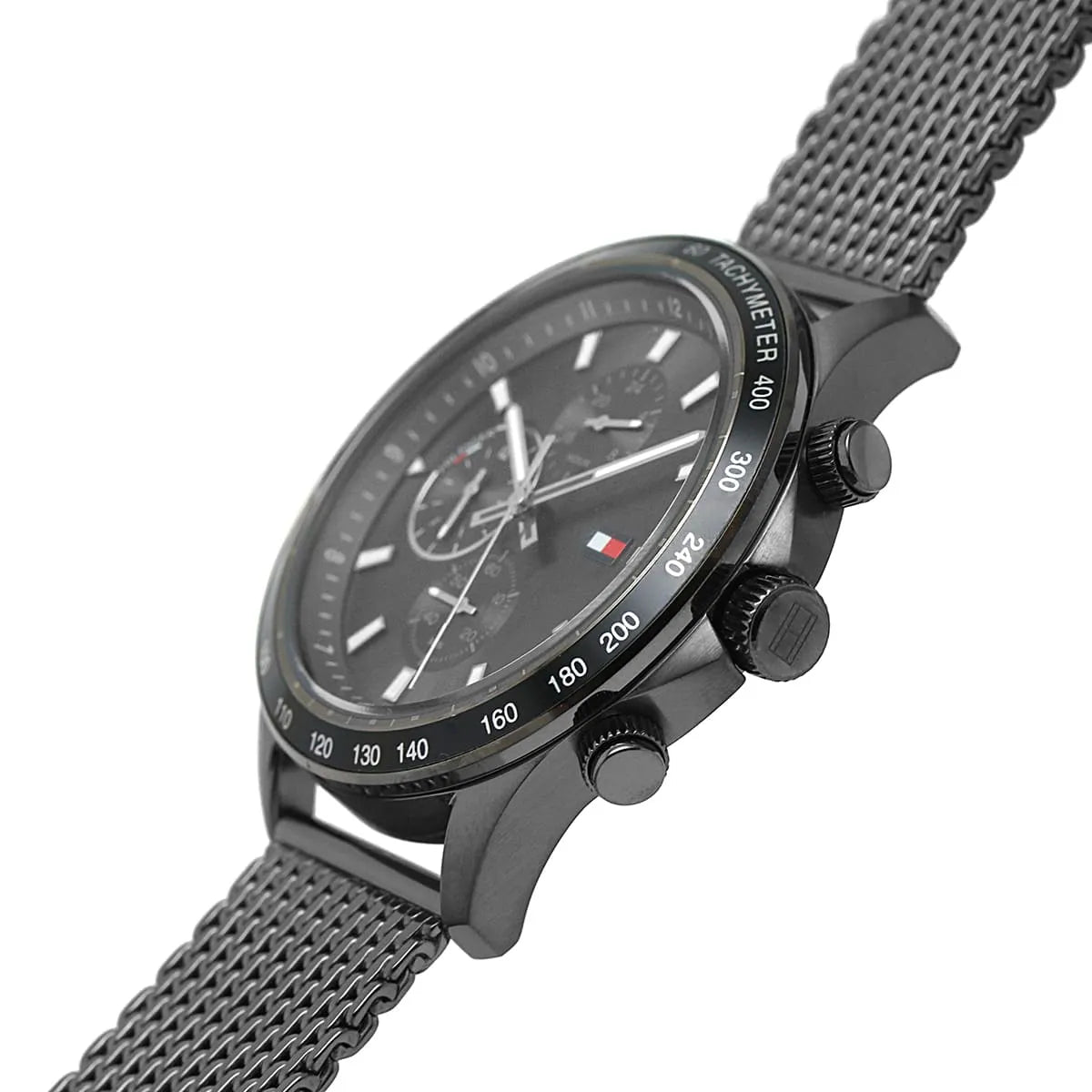 Tommy Hilfiger Miles watch side profile showing chronograph pushers and steel mesh strap