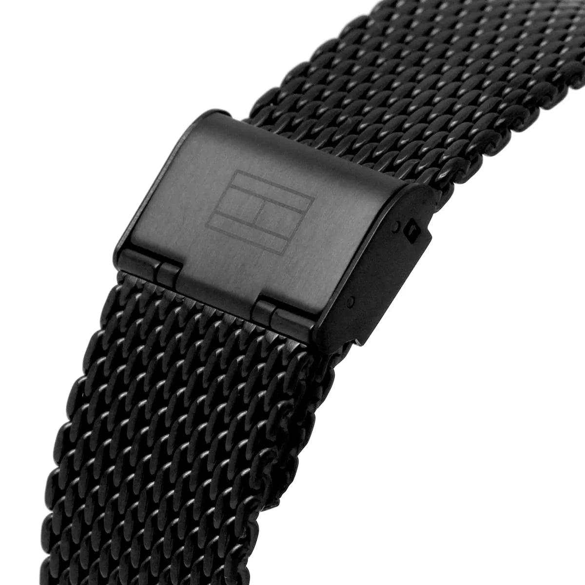 Close-up of black mesh strap with metal closure and Tommy Hilfiger branding